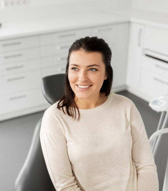 Woman smiling at dentist during consultation for dental implants in Corpus Christi
