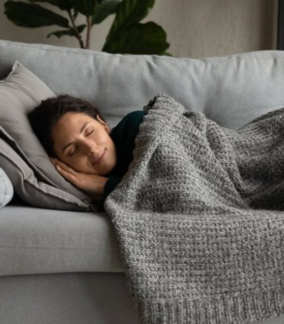 Woman sleeping peacefully on her couch