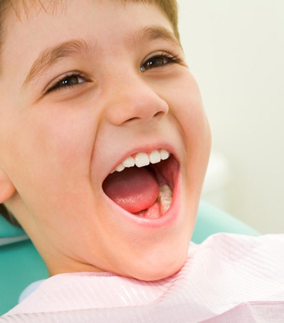 Child in Corpus Christi speaking and smiling 