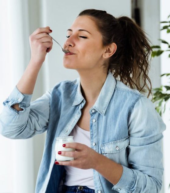 Woman eating yogurt