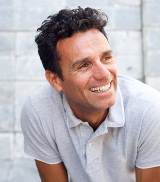 a man smiling with healthy teeth