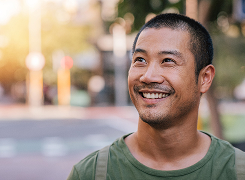 Man smiling outside
