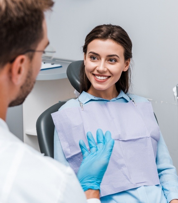 Woman smiling at her dentist