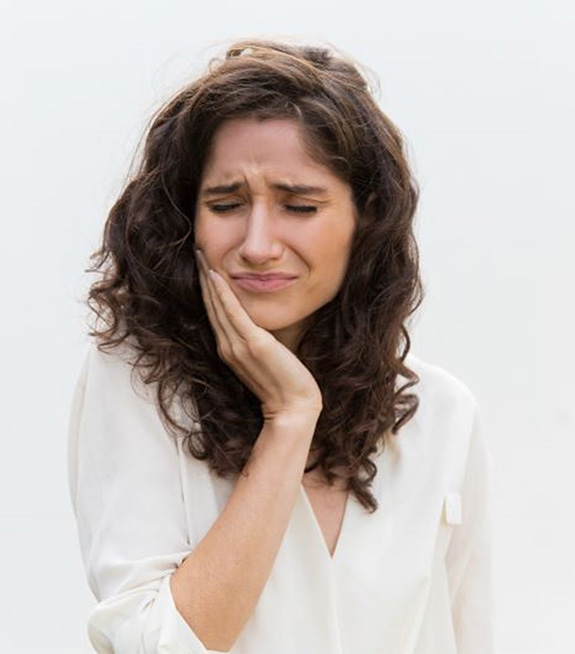 Grimacing woman with toothache