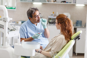 Dentist talking to their patient